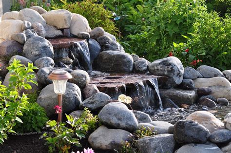 Landscaping Beautiful Garden Waterfalls With Natural Rock Surround By