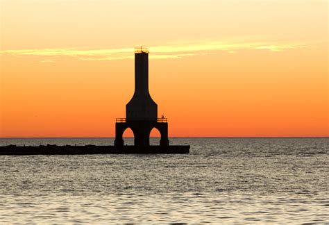 Daybreak Over The Lighthouse At Port Washington Wisconsin Image Free