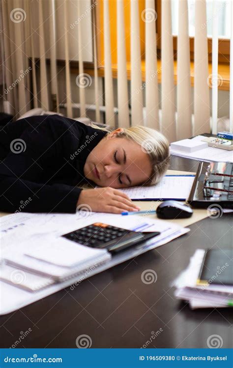 Portrait Of A Beautiful Young Business Woman Sleeping At Her Workplace