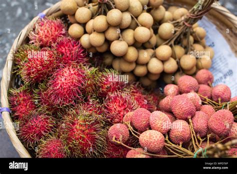 Basket With Fresh Exotic Fruits Of Rambutan Lychee And Longan On Asian