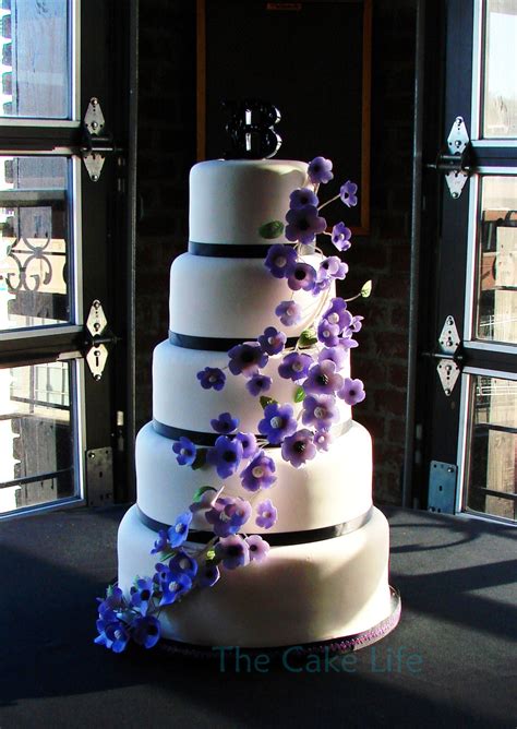 From seasonal wedding flower colors & cost, to gorgeous wedding, wedding flowers. 5 Tier Round Wedding Cake With Purple Flowers ...