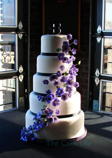 Mar 15, 2021 · choosing wedding flowers is not the easiest of tasks. 5 Tier Round Wedding Cake With Purple Flowers ...