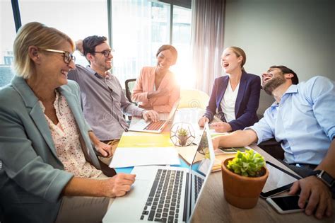 Business People Laughing During A Meeting Stock Image Image Of