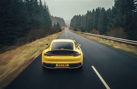 Porsche 911 Carrera 4s On Road Yellow Hd Wallpaper Pxfuel