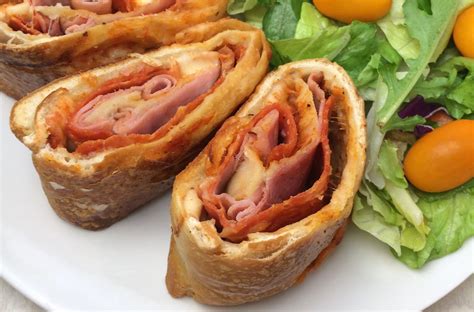 Bread dough, cheese (typically mozzarella), meat or vegetables are the main ingredients. Easy Stromboli Recipe