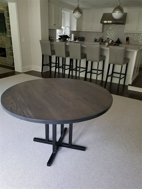Ikea dining tables come with different sizes and heights. $8" round oak with dark gray stain and steel pedestal base ...