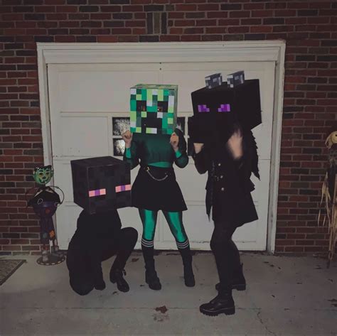 Three People Dressed Up As Minecraft Characters In Front Of A Garage Door With Their Hands On