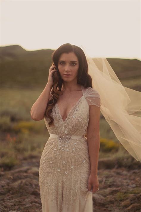 Fashion wedding gowns from the most popular bridal designers star embroidered blue wedding dress in beaded tulle and silk chiffon with low back and medieval split sleeves | heavenly celestial twilight fairytale. Can I Wear An Ivory Wedding Dress & Have White Flowers?
