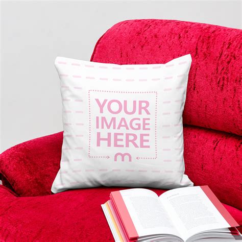 Pillow On Vibrant Red Couch With Book Mockup Mediamodifier