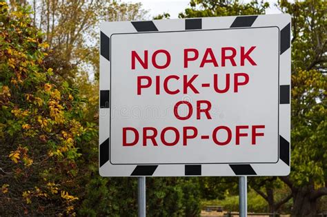 A No Parking Sign On A Board No Park No Pick Up No Drop Off Warning