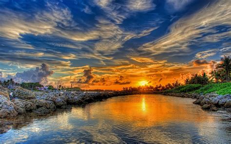 Breathtaking Golden Sunset Merging With The Lake Wallpaper