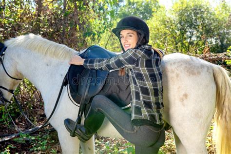 Young Woman Rider Mounting A White Horse Stock Image Image Of