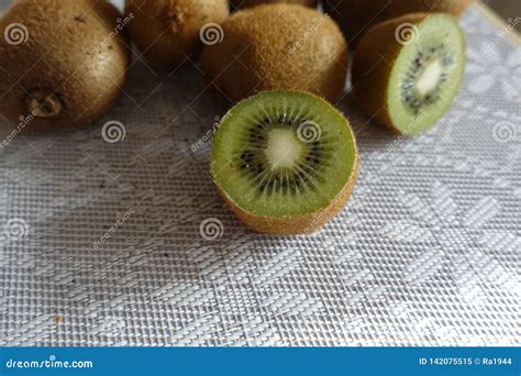 Fresh Kiwi Fruit On The Table Whole And Cut Stock Image Image Of