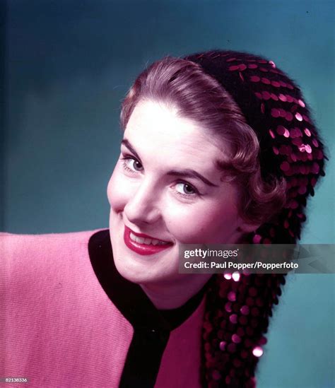 Circa 1950s A Portrait Of An Auburn Haired Girl Wearing A News