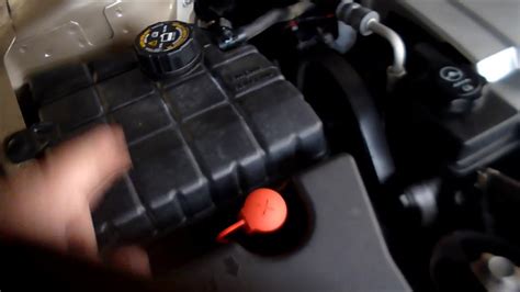 Remove seat by pulling up the front of the seat till it unlatches. Cadillac DTS Battery location and how to Jump Start - YouTube