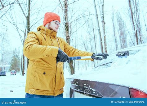 Young Man Clean Car After Snow Storm Stock Photo Image Of Frost