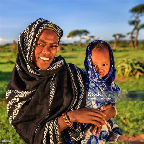 Woman From Borana Tribe Holding Her Baby Ethiopia Africa Stock Photo