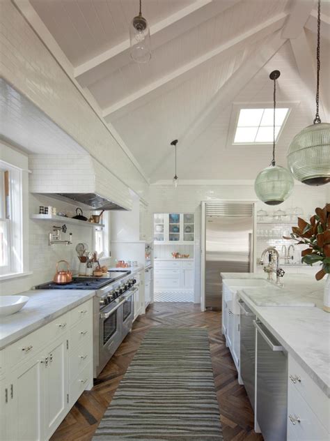 By newdecor 2 years ago2 years ago. Large White Kitchen With Long Marble Countertop Island and Plank Board Vaulted Ceiling | HGTV