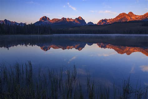 First Light Illuminating Sawtooth Mountains Stanley Idaho Photograph By