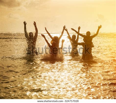 Silhouettes Young Group People Jumping Ocean Stock Photo Edit Now