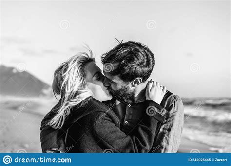 Romantic Hipster Couple In Love Kissing On Shoreline At The Wild Beach Babefriend And