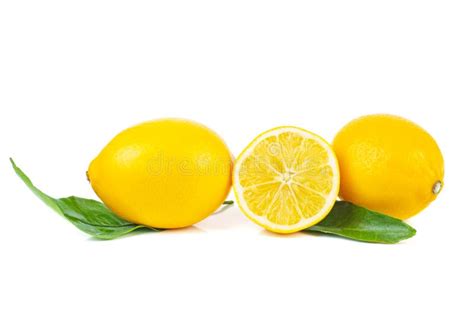 Two Whole And Half Lemons With Leaves Isolated On A White Stock Photo