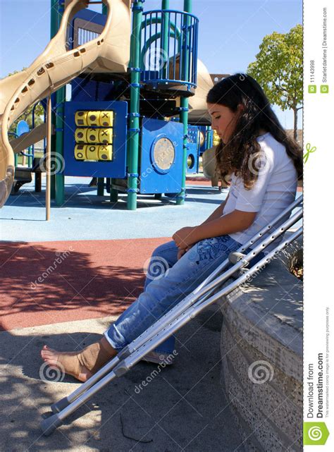 Young Girl With Crutches At Playground Stock Photo Image