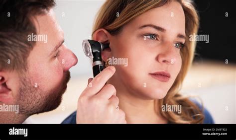 Otolaryngology Ear Check Using Otoscope Doctor Examining Patient Stock