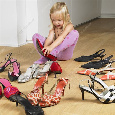 Girl Trying On Her Mothers Shoes Stock Image F0037482 Science