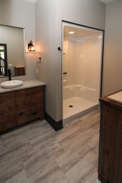 Our bathroom vinyl floor tiles give you the luxurious look of solid floors like stone and ceramic tiles, without the added upkeep, because they are so luxury vinyl tiles are made especially for rooms where spills are expected like bathrooms, but they can also work in kitchens, laundry rooms, and. Gray Luxury Vinyl Tile Bathroom Flooring | Vinyl tile ...