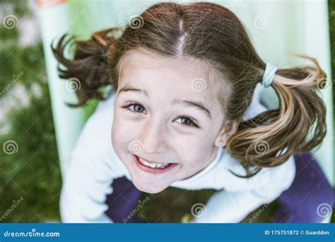 Portrait Of A Happy Little Girl On Slide Stock Photo Image Of Cute