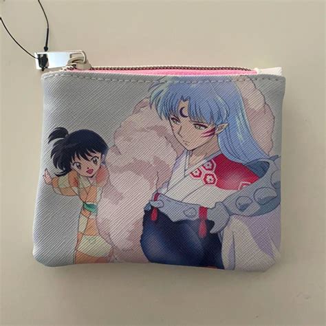 A Small Zipper Bag With Anime Characters On It