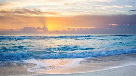 Beautiful Ocean Waves Beach Sand During Sunset Under White