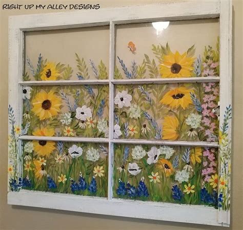 An Old Window Painted With Sunflowers And Daisies