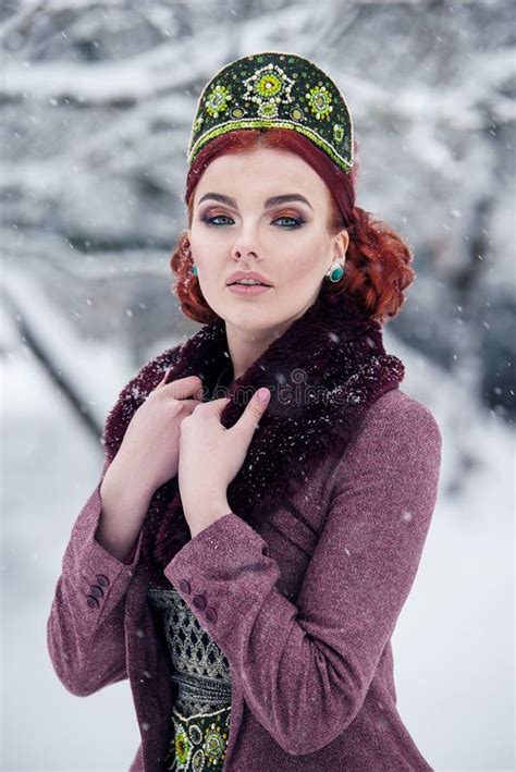 Portrait Of A Gorgeous Young Woman In Russian Style Dress On A Strong