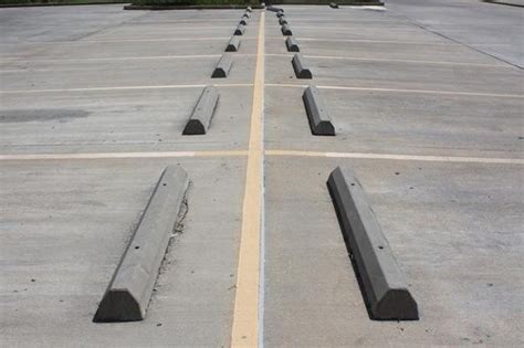 What are the cement stoppers in parking lots called? - Quora