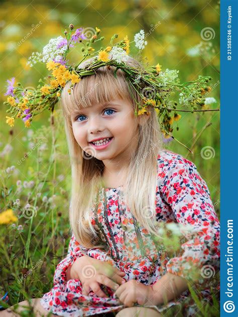Little Girl Smiling Outdoor On The Summer Meadow Portrait Of Small Kid