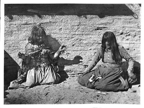 Two Mojave Indian women playing a game (fortune-telling with bones