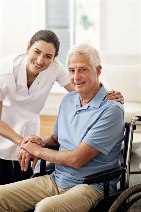 Portrait Nurse And Disabled Man In Wheelchair Medical Wellness And Support In Nursing Home