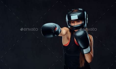 Beautiful Brunette Female Boxer In Sportswear Isolated On Dark