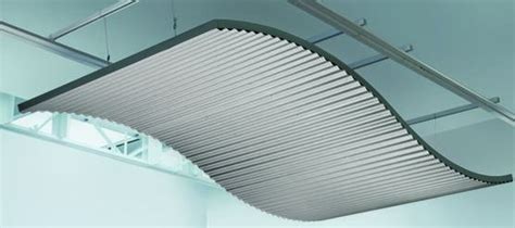 Manufacturers of contemporary and classic decorative pressed metal panels suitable for a wide variety of ceiling and wall installations. Industrial Look Corrugated Ceiling Panels - retrofit