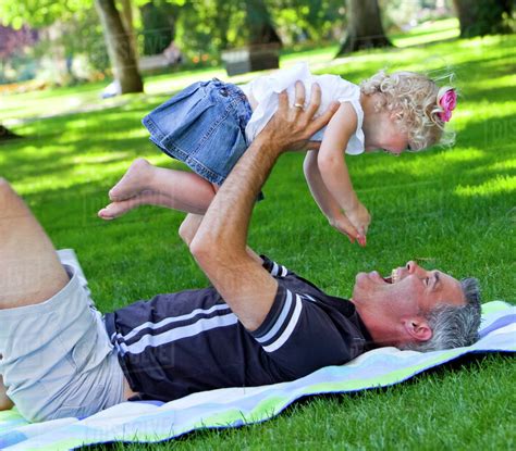 Father And Young Daughter Spending Quality Time Together In A Park
