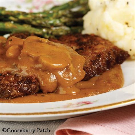 Mar 26, 2020 · salisbury steak originates in the united states and is a popular dish made with seasoned ground beef patties that are smothered in gravy with mushrooms (often accompanied by caramelized onions). Gooseberry Patch Recipes: Baked Steak with Gravy from 101 ...