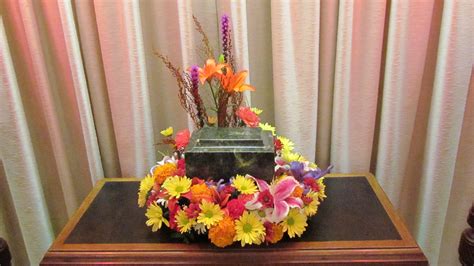 Lutz flowers was an original member of ftd. A cremation piece of mixed yellow daisies, pink stargazer ...