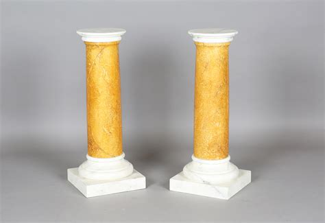 A Pair Of 20th Century Pedestals Painted To Simulate Carrara And