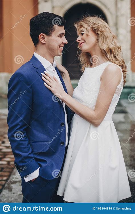 Stylish Couple Embracing In European City Street Sensual Romantic Moment Fashionable Bride And