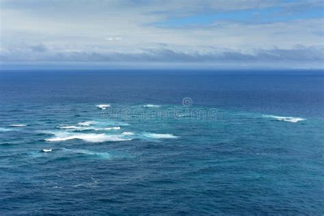 Boundary Where The Tasman Sea Meets The Pacific Ocean At Cape Reinga In
