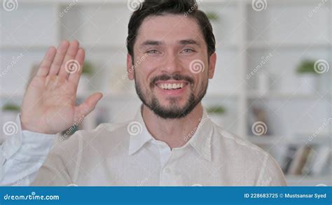 Cheerful Young Man Waving Hello Stock Image Image Of Laughing