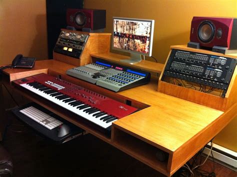 Complete with rack mount gear, midi keyboard tray, wireless charging, and a gaming pc, and all neatly organized. http://www.gearslutz.com/board/low-end-theory/536451-another-diy-desk-build.html | Home Studio ...