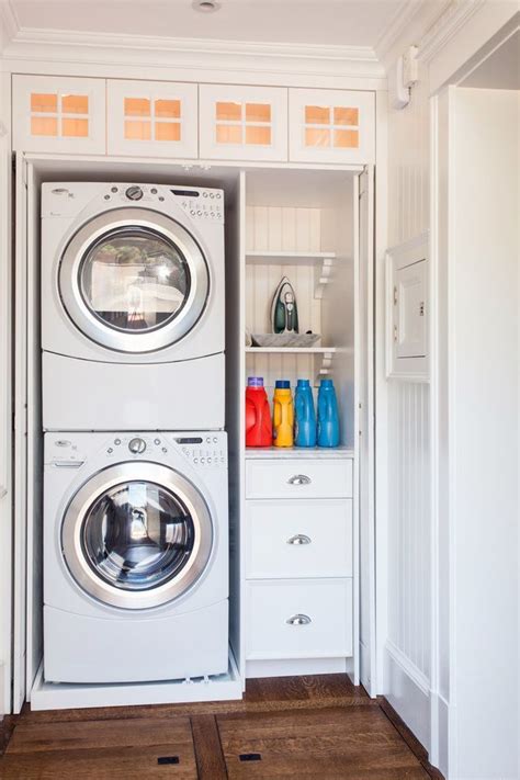 Learn how to install diy closet shelves, and organize that mess. Hidden laundry closet with stackable front loading washer and dryer and built-in storage - Lewis ...
